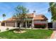 Charming single-story home with a well-manicured lawn and lush landscaping, offering inviting curb appeal at 4525 E Desert View Dr, Phoenix, AZ 85044