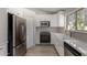 Updated kitchen with new appliances, white cabinets and countertops at 4525 E Desert View Dr, Phoenix, AZ 85044