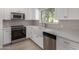 Updated kitchen with white countertops and new appliances at 4525 E Desert View Dr, Phoenix, AZ 85044