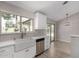 Updated kitchen with farmhouse sink and access to outdoor dining at 4525 E Desert View Dr, Phoenix, AZ 85044
