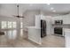Living room adjacent to kitchen with breakfast bar and new appliances at 4525 E Desert View Dr, Phoenix, AZ 85044