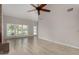 Bright living room with wood floors and a ceiling fan provides ample natural light, creating a comfortable space at 4525 E Desert View Dr, Phoenix, AZ 85044