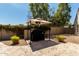 Outdoor grill area with covered pergola, built-in grill, and custom tiled patio at 4525 E Desert View Dr, Phoenix, AZ 85044