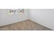 Bedroom with neutral carpeting and bright natural light at 46378 W Lander Ln, Maricopa, AZ 85139