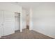 Bedroom with sliding closet doors and access to the hallway at 46378 W Lander Ln, Maricopa, AZ 85139
