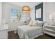 Cozy bedroom featuring a bright window with natural light, and stylish decorations at 46378 W Lander Ln, Maricopa, AZ 85139