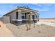 Attractive single-Gathering home with stone accents, a cozy porch, and low-maintenance desert landscaping at 46378 W Lander Ln, Maricopa, AZ 85139