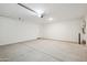 Spacious two car garage with water heater and door to outside at 46378 W Lander Ln, Maricopa, AZ 85139