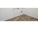 Tiled laundry room with utility hookups at 46378 W Lander Ln, Maricopa, AZ 85139
