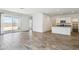 Open-concept living area featuring tile floors and sliding glass doors to the backyard at 46378 W Lander Ln, Maricopa, AZ 85139