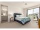 Cozy bedroom with a sliding door to a balcony and ensuite bathroom access at 5100 E Rancho Paloma Dr # 2078, Cave Creek, AZ 85331