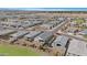 Expansive aerial view of a neighborhood showcasing numerous single-Gathering homes and community layout at 5237 W Alta Mesa Ave, Laveen, AZ 85339