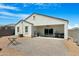 Backyard area with hardscape patio, gravel landscaping and covered patio, perfect for outdoor enjoyment at 5237 W Alta Mesa Ave, Laveen, AZ 85339