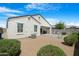 Backyard featuring a hardscape patio, gravel landscaping and covered patio, an outdoor space for relaxing at 5237 W Alta Mesa Ave, Laveen, AZ 85339