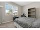 Bright bedroom with a window view, comfortable seating, and practical desk area for work at 5237 W Alta Mesa Ave, Laveen, AZ 85339