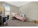 Inviting bedroom featuring neutral walls, plush carpet, and a well-lit desk area at 5237 W Alta Mesa Ave, Laveen, AZ 85339