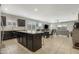 Open kitchen area with a large island, flowing seamlessly into the dining and living spaces at 5237 W Alta Mesa Ave, Laveen, AZ 85339