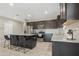 Spacious kitchen featuring a granite island, stainless steel appliances, and ample cabinet space at 5237 W Alta Mesa Ave, Laveen, AZ 85339