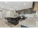 Spacious kitchen with a granite island, stainless steel appliances, and ample cabinet space at 5237 W Alta Mesa Ave, Laveen, AZ 85339