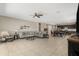 Spacious open concept living room with tile floors, dark cabinets and ceiling fan at 5237 W Alta Mesa Ave, Laveen, AZ 85339