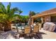 Backyard showcasing a private pool with lounge seating and a covered patio for outdoor dining at 553 W Hereford Dr, San Tan Valley, AZ 85143