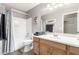 Bathroom showcasing a white vanity, toilet, shower and tub with a gray curtain, and tile floors at 553 W Hereford Dr, San Tan Valley, AZ 85143