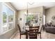 Breakfast nook features a sliding glass door and views of the lush backyard at 553 W Hereford Dr, San Tan Valley, AZ 85143
