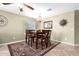 Cozy dining room featuring a wooden table with chairs, a decorative rug, and a chandelier at 553 W Hereford Dr, San Tan Valley, AZ 85143