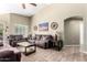 Inviting living room showcasing comfortable sofas, a ceiling fan, and tasteful decor at 553 W Hereford Dr, San Tan Valley, AZ 85143