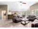 Open-concept living room with comfortable sofas and seamless access to dining and kitchen areas at 553 W Hereford Dr, San Tan Valley, AZ 85143