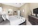 Main bedroom offers an ensuite bathroom and a serene atmosphere with plenty of light at 553 W Hereford Dr, San Tan Valley, AZ 85143
