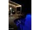Outdoor patio with a fire pit, seating, and a softly lit, inviting ambiance at 553 W Hereford Dr, San Tan Valley, AZ 85143