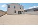 Spacious backyard with the home's rear exterior and a blank slate for landscaping at 5535 S 240Th Ln, Buckeye, AZ 85326