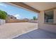 View of the large backyard with ample space and a covered patio at 5535 S 240Th Ln, Buckeye, AZ 85326