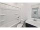 Bathroom featuring a shower/tub combo with white tile surround, toilet, and sink at 5535 S 240Th Ln, Buckeye, AZ 85326