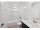 Clean bathroom with a white tub-shower combo and a modern vanity with a single sink at 5535 S 240Th Ln, Buckeye, AZ 85326