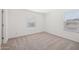 Vacant carpeted bedroom with natural light from windows, ready for personalization at 5535 S 240Th Ln, Buckeye, AZ 85326