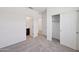 The bedroom includes neutral carpet, closet and an attached bathroom with a dark vanity at 5535 S 240Th Ln, Buckeye, AZ 85326