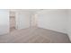 Empty bedroom with neutral carpet, closet and multiple doors at 5535 S 240Th Ln, Buckeye, AZ 85326