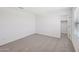 A secondary bedroom features neutral carpet, white walls, and a closet at 5535 S 240Th Ln, Buckeye, AZ 85326