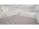 An open bonus room features neutral carpet, white walls, and ample natural light at 5535 S 240Th Ln, Buckeye, AZ 85326