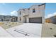 Attractive two-story home boasts a large driveway and a well-maintained xeriscaped front yard at 5535 S 240Th Ln, Buckeye, AZ 85326