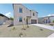 Inviting two-story home with desert landscaping, a two-car garage, and a charming front entryway at 5535 S 240Th Ln, Buckeye, AZ 85326