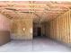 Unfinished two-car garage showing insulation and framing at 5535 S 240Th Ln, Buckeye, AZ 85326