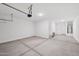 This spacious garage features concrete flooring and includes water heater, door to home and door to outside at 5535 S 240Th Ln, Buckeye, AZ 85326