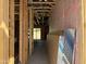 Interior view of a new home, showcasing the exposed framing and pink insulation at 5535 S 240Th Ln, Buckeye, AZ 85326