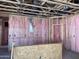 Unfinished room shows wooden framing, pink insulation, and exposed wiring at 5535 S 240Th Ln, Buckeye, AZ 85326