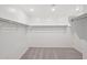 Spacious walk-in closet with multiple bars, shelves, and neutral carpet at 5535 S 240Th Ln, Buckeye, AZ 85326