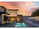 Modern home featuring a pool, pickleball court, and landscaped backyard with cactus accents at 5814 E Camelback Rd, Phoenix, AZ 85018