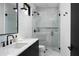 Sleek bathroom with modern vanity, walk-in shower, and contemporary finishes at 5814 E Camelback Rd, Phoenix, AZ 85018